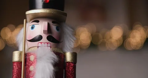 Project video of wooden Nutcracker figurine standing still with shiny bokeh Stock Footage 287176776