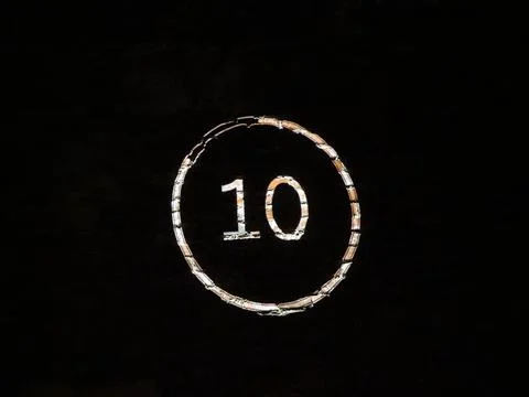 Projected number 10 on wall black Stock Photos
