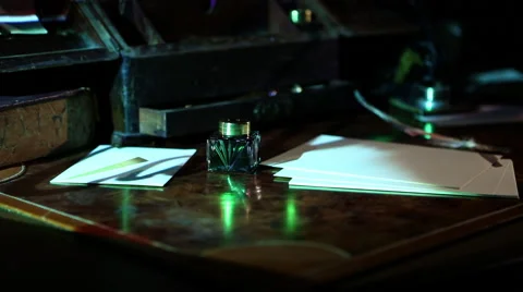 Projected writing calligraphy on old desk jib up 3 Stock Footage 47456709
