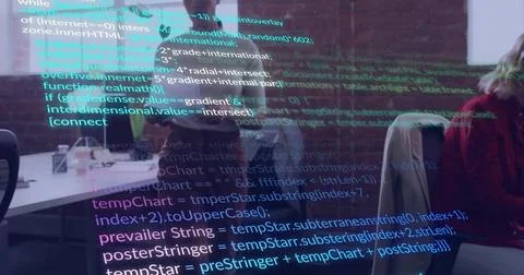 Projecting colorful source code overlay across open-plan office, with monitors, 스톡 사진