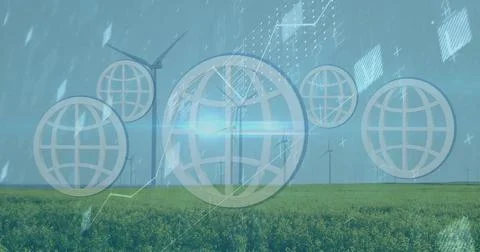 Projecting data charts and globe network icons onto green crop field around Foto stock