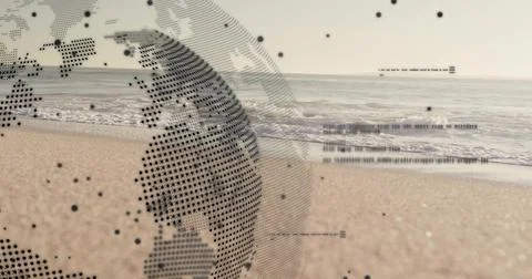 Projecting digital dot-matrix globe hovering above sandy shoreline, ocean waves Stock Photos