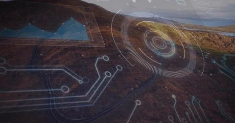 Projecting digital HUD interface hovering over brown hillside, with circuit Stock Photos