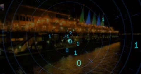 Projecting digital overlay with grid lines and binary code over lit building Stock Photos