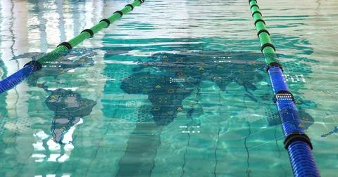Projecting global map overlay across lap pool water, showing green or black and Foto stock