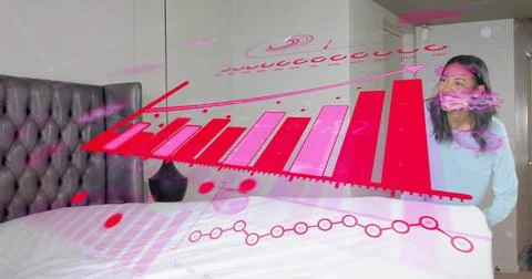 Projecting large holographic bar chart over bed, overlapping woman in light blue Stock Photos