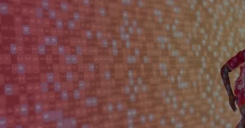 Projecting numeric code across digital studio backdrop, with man wearing red Stock Photos