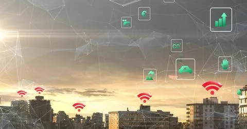 Projecting polygonal mesh network across city skyline at sunset, showing red Stock Photos