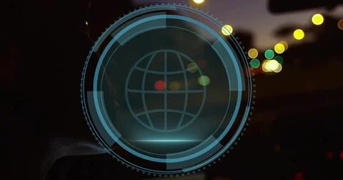 Projecting translucent cyan-blue HUD overlay on windshield at night, with globe Stock Photos