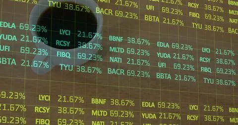 Projecting translucent grid of financial ticker symbols and percent on wooden Foto stock