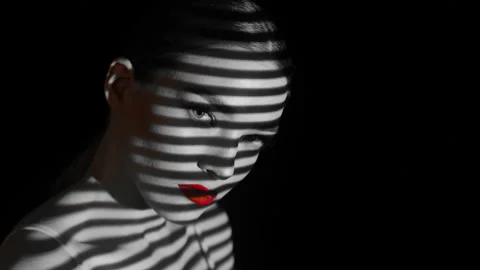 Projection of black and white lines on the girl’s face and body. Stock Footage 104180572