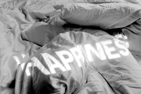 A projection of happiness on a bed Stock Photos