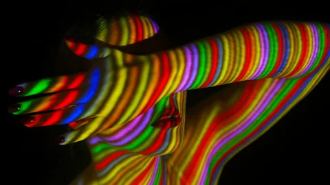 Projection of the multicolored lines on face and body of the girl. Stock Footage 104214762