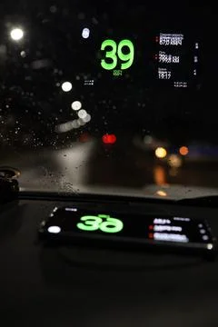 Projection of the navigator on the windshield of the car at night Stock Photos
