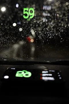 Projection of the navigator on the windshield of the car at night Stock Photos