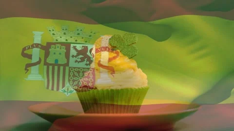 Projection starting, sheer Spanish flag rippling across cupcake on saucer, Stock Footage 330159606