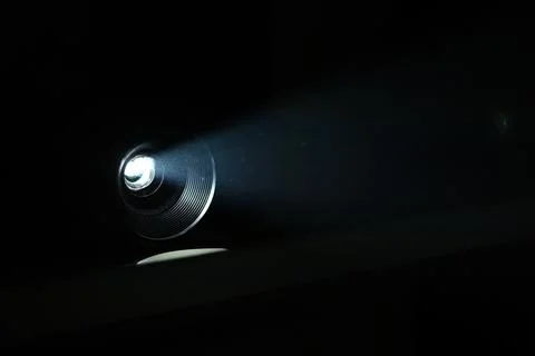 Projector beam on black background closeup Stock-Fotos