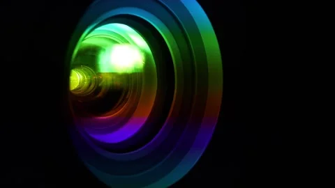Projector lens in operation. Spectral decomposition of light. Dispersion Stock Footage 284435680