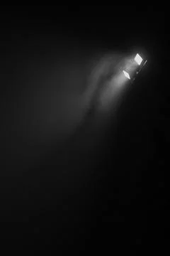 Projector light in the darkness Stock Photos
