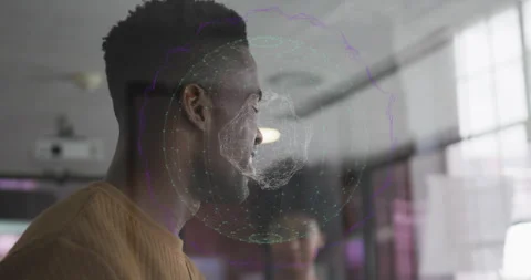 Projector projecting globe causing developer shifting gaze, colleague nodding in Stock Footage 315897389