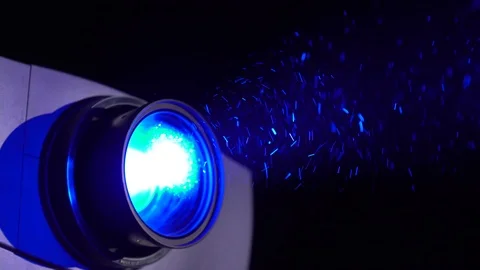 The projector is turned on projects blue Stockbeeldmateriaal 114509514