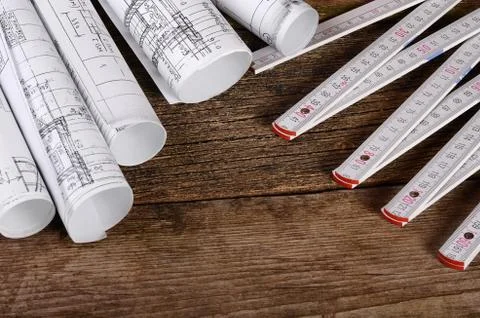 Projects of houses on wooden background Stock Photos