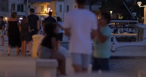 Promenade in the city on a summer evening. Postira, island of Brac, Croatia. Stock Footage 137623341