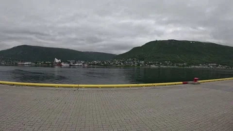 Promenade view of Arctic Cathedral and Storsteinen mountain in Tromso Norway Vidéo 341697358