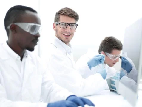 Promising scientist working on a computer in the laboratory Foto stock