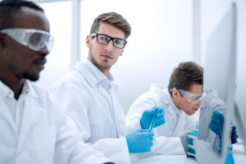 Promising scientist working on a computer in the laboratory Foto stock