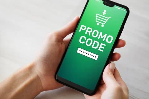 Promo code Discount coupon number field on mobile phone screen. Business and Stock Photos