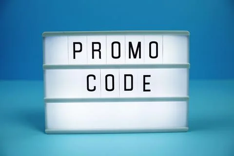 Promo Code letterboard text on LED Lightbox on blue background Stock Photos