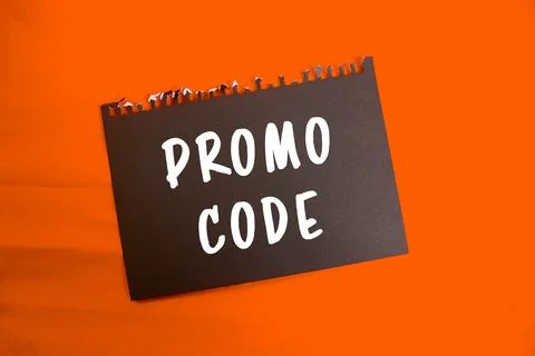 Promo Code message written on ripped torn paper background. Conceptual Prom.. Stockfoto's