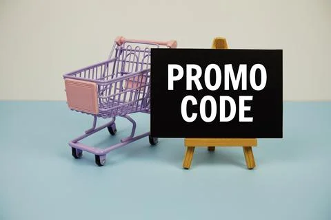 Promo code text message and trolley shopping cart on blue background Stock Photos