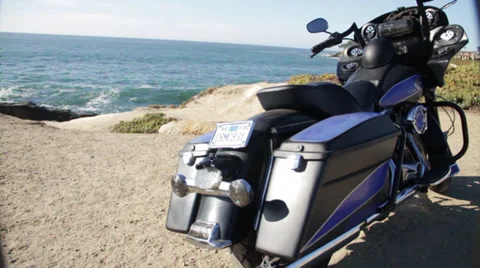 Promoting the new model motorcycle harley division by the pacific ocean Stock Footage 35442515