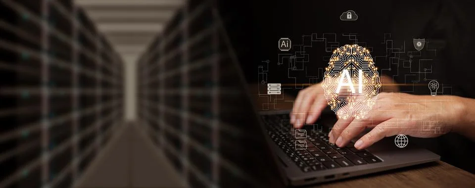 Prompt engineer using artificial intelligence on laptop inside a data cente.. Stock Photos
