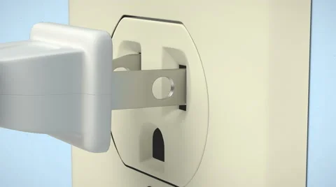 A  pronged electric plug is inserted into a receptacle. Stock Footage 62248349