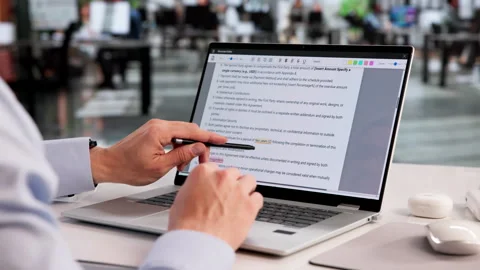 Proofreader Carefully Reviews Laptop Document Video stock 331518301