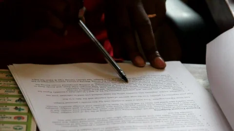 Proofreading document in Kenya Stock Footage 749795