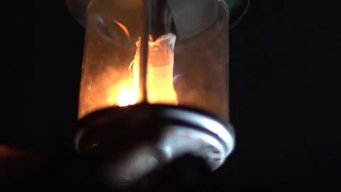 Propane gas lantern filament igniting into bright blue and orange flames. Stock Footage 122763115