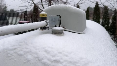 Propane Tank for Home Heating Covered in Snow Stock Footage 301085603