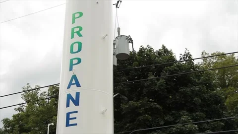 Propane white vertical cylinder refill station with propane written on it Video stock 247143663
