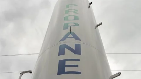 Propane white vertical cylinder refill station with propane written on it Video stock 247143678
