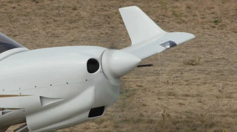 Propeler working on the bow of a white airplane Stock Footage 38571602
