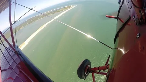 Propeller Airplane over Ocean Stock Footage 81287702