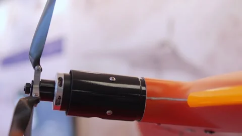 Propeller is attached to a red and orange device Video stock 311394855