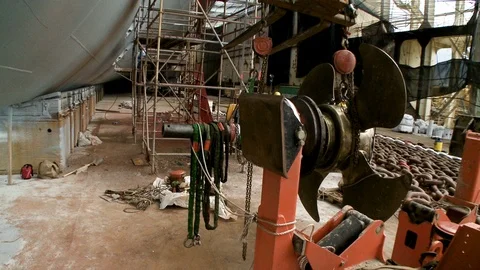 Propeller being mounted to ship in boatyard Stock Footage 123728696
