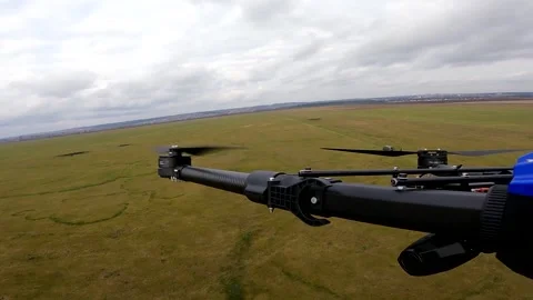 The propeller of the drone spins in the air during flight. Green box at the Stock-Footage 221677307