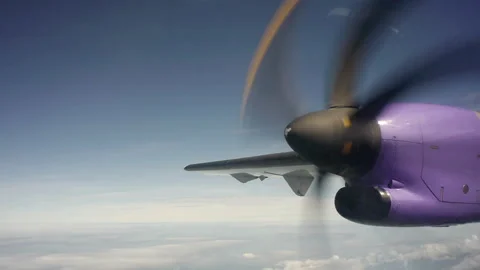 Propeller on a pink Plane Flying Stock Footage 247480179