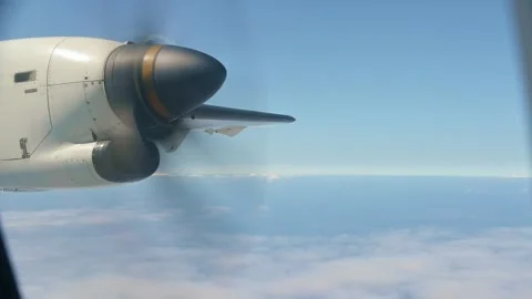 Propeller plane flying over cloudy sky on summer day Stock Footage 253900388